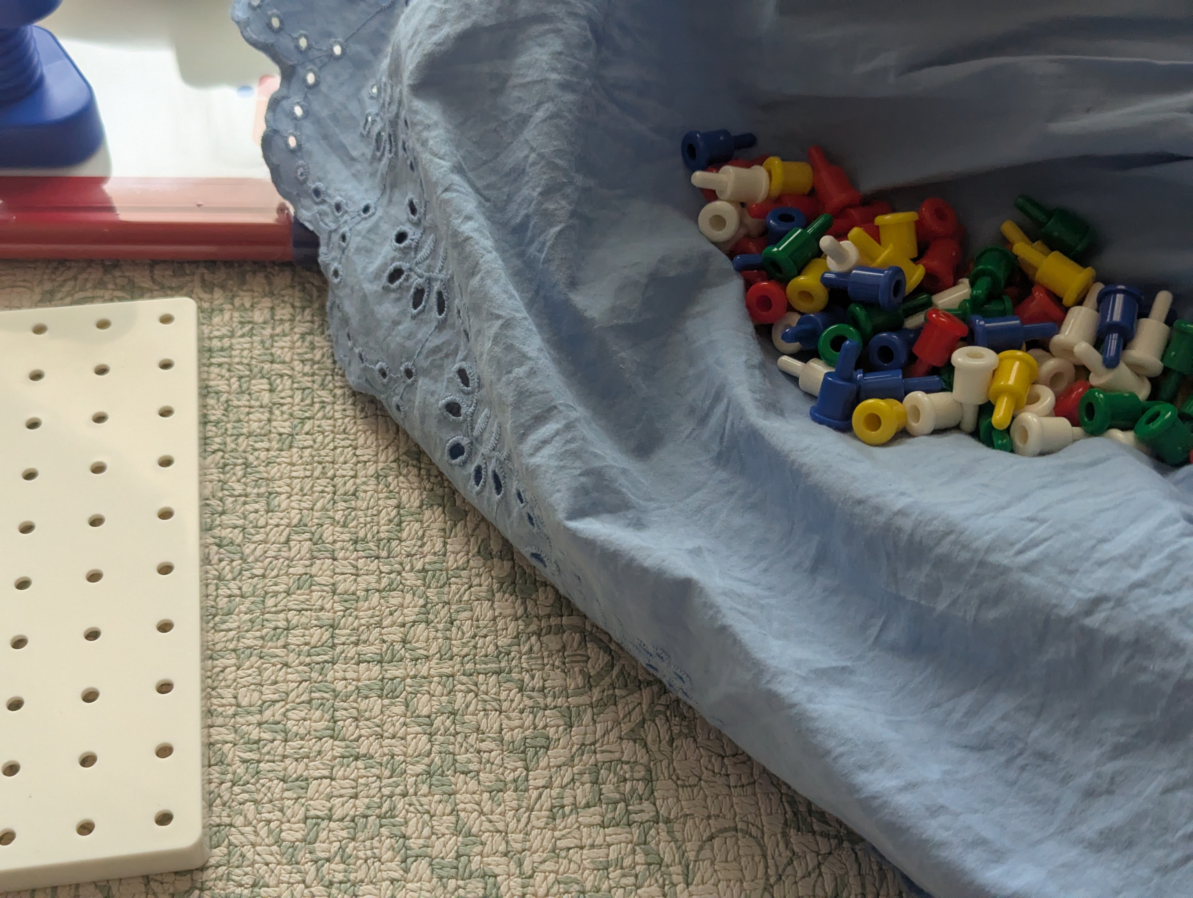 A member and parent playing with colourful toys